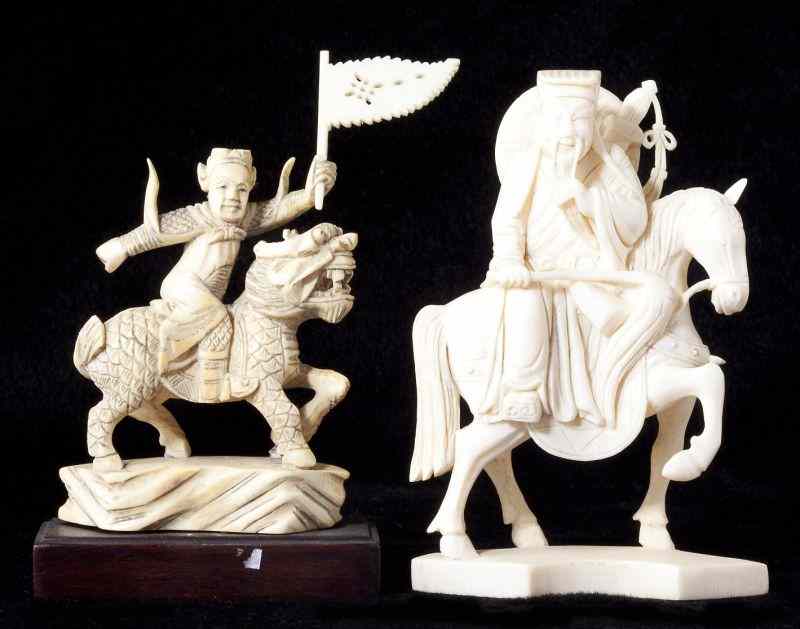 Appraisal: Two Chinese Carved Ivory Ridersthe first is a flag waving