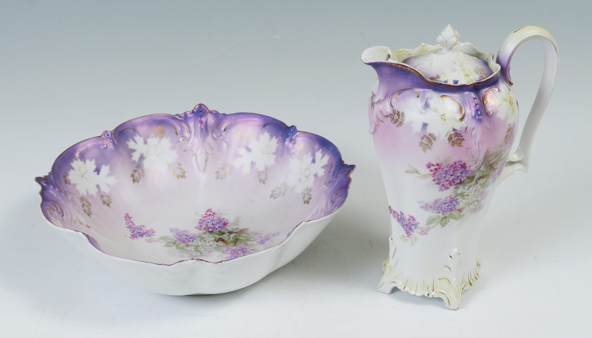 Appraisal: RS PRUSSIA BOWL AND CHOCOLATE POT Lilacs on a soft