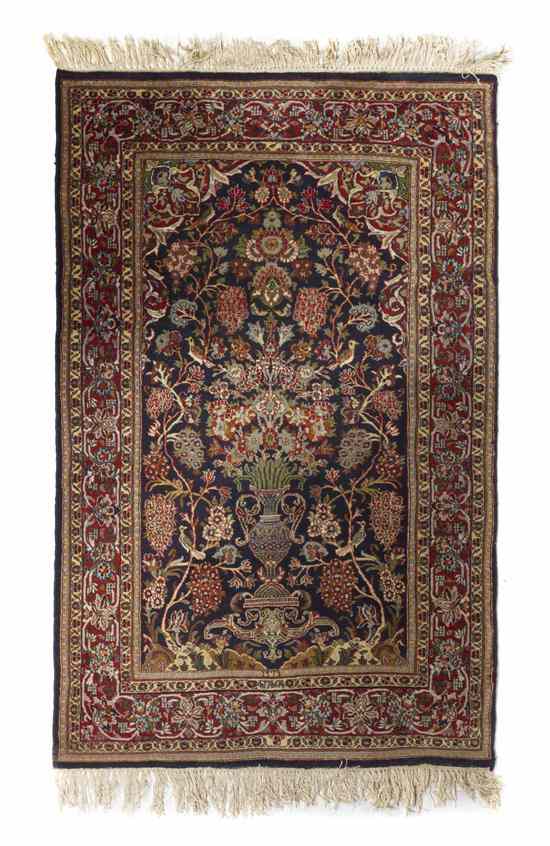 Appraisal: A Persian Wool Prayer Rug having an urn issuing flowers