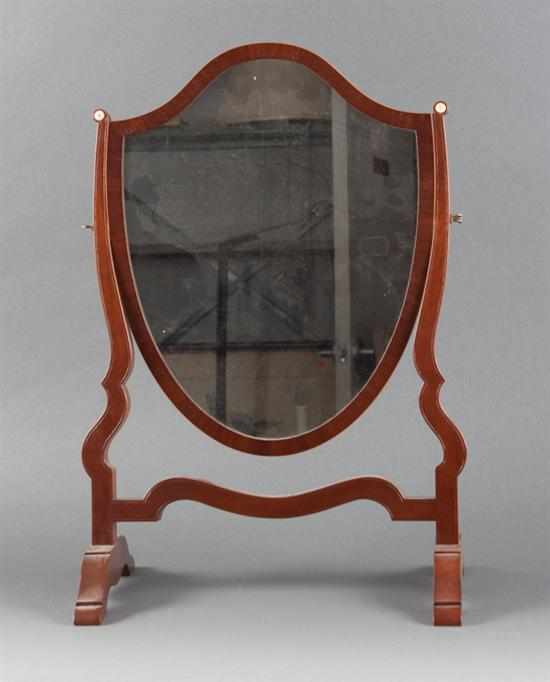 Appraisal: Georgian style inlaid mahogany shaving mirror th century shield-shaped mirror