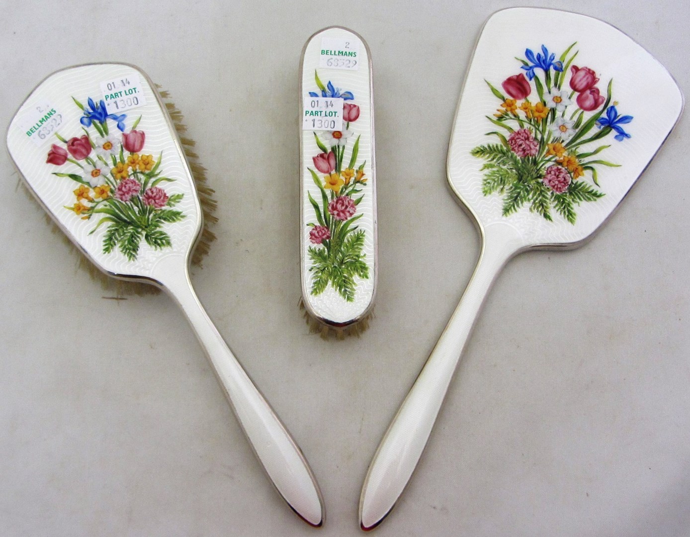 Appraisal: A ladies enameled three piece dressing set comprising a hand