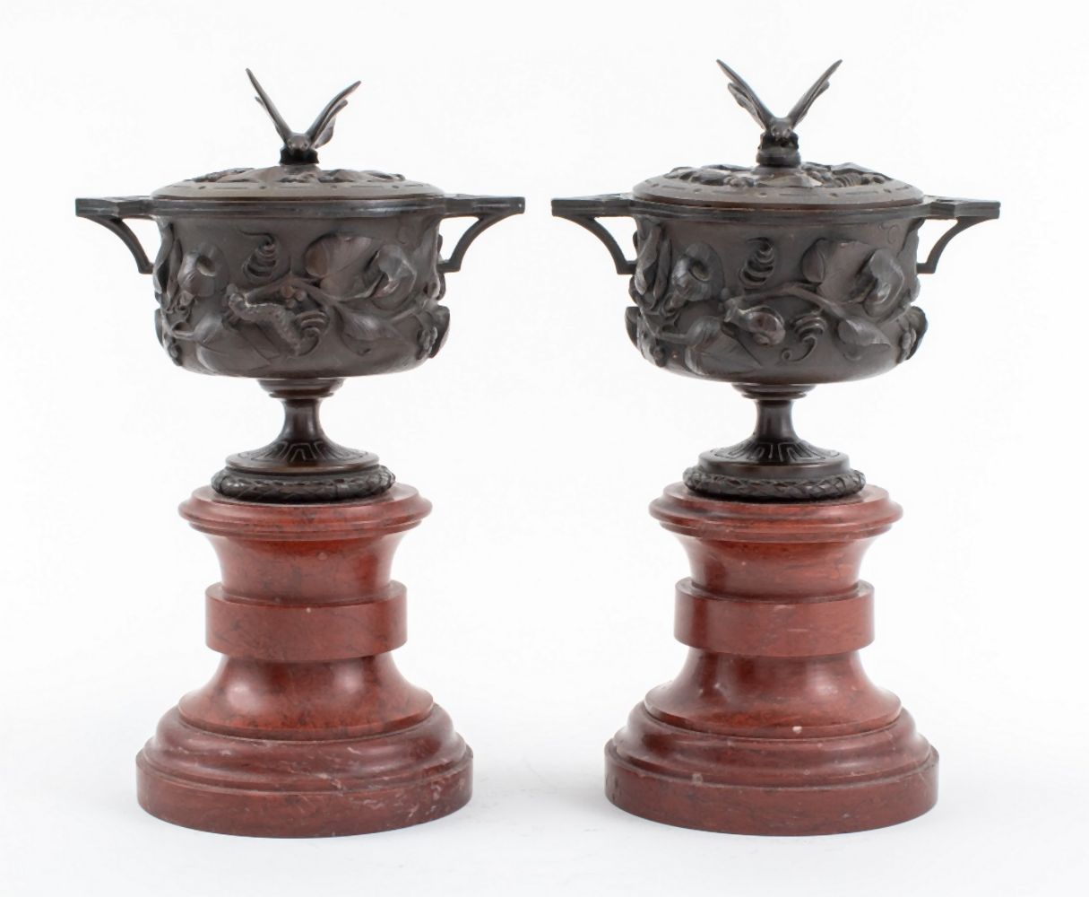 Appraisal: NEOCLASSICAL BRONZE COVERED URNS ON MARBLE PAIR Pair of Neoclassical