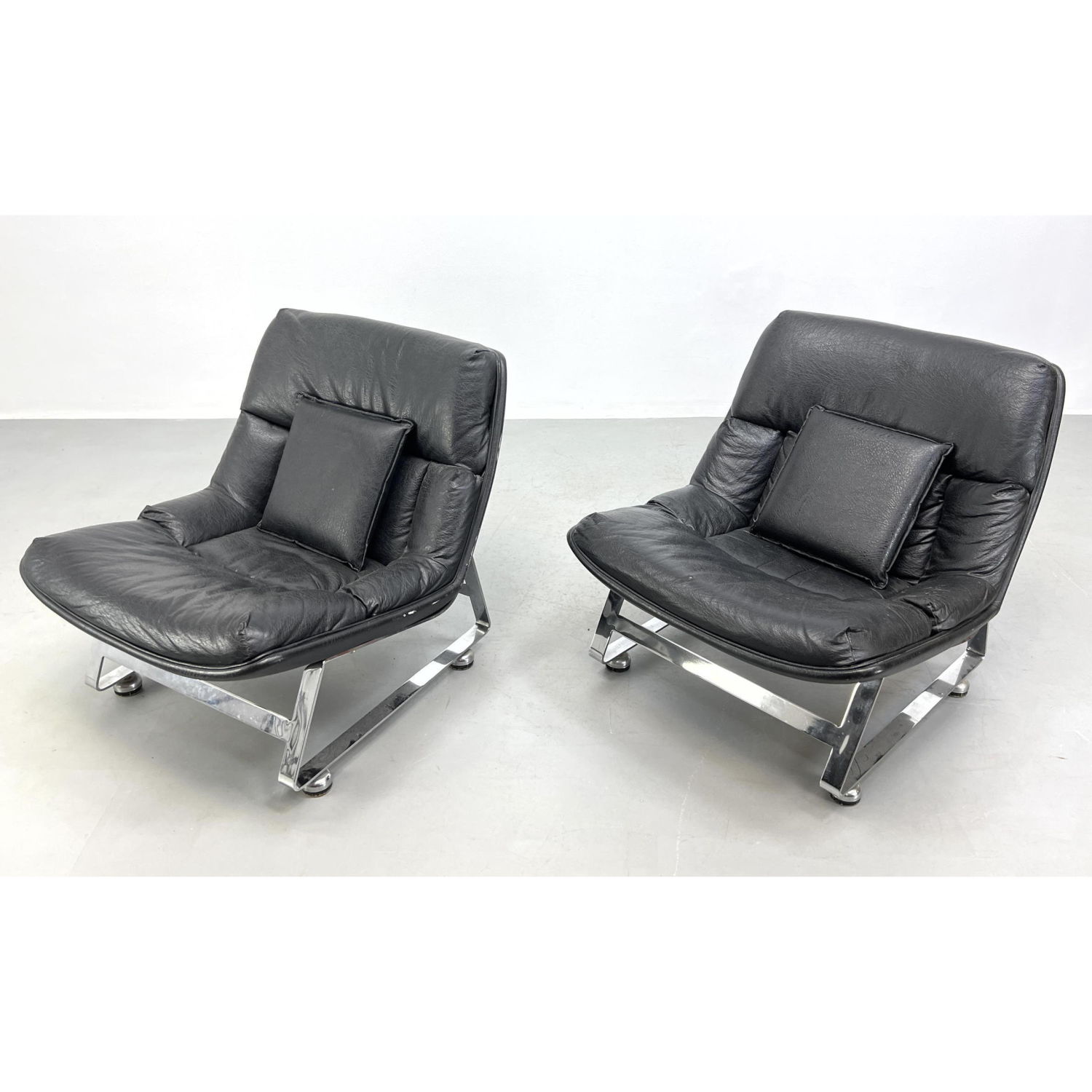 Appraisal: Pr Modernist Wide Flat Chrome Framed Lounge Chairs Black Vinyl