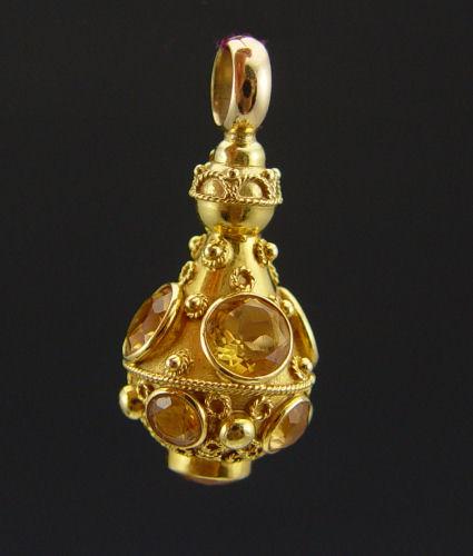 Appraisal: K CITRINE FOB PENDANT K yellow gold Etruscan style fob