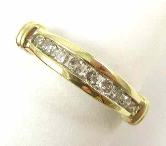 Appraisal: DIAMOND AND TEN KARAT YELLOW GOLD RING set with nine