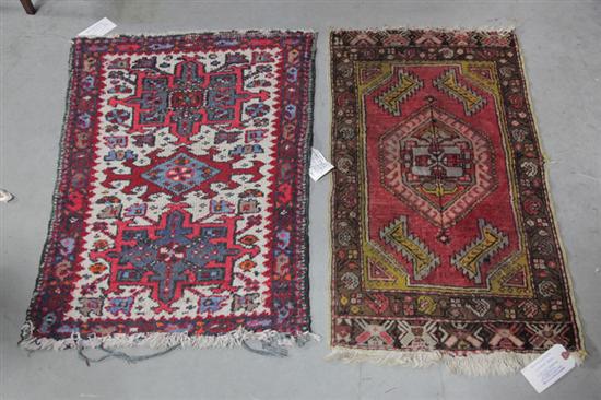 Appraisal: TWO ORIENTAL STYLE MATS Red ground with geometric spandrels and