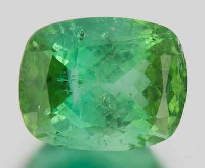 Appraisal: An Unmounted Green Tourmaline Carat Cushion cut weighting ct Displays