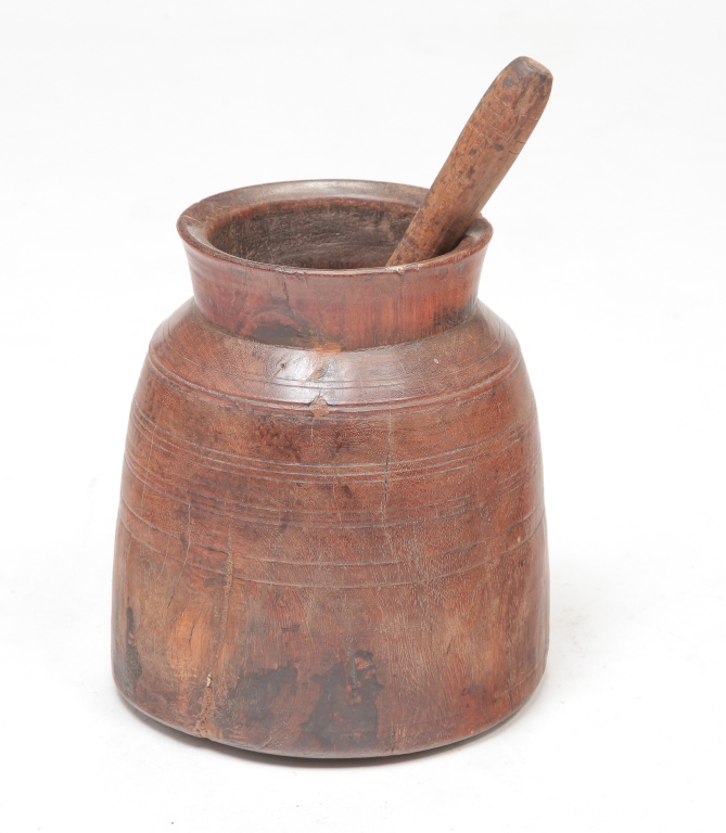 Appraisal: EUROPEAN TREENWARE MORTAR AND PESTLE Nineteenth century hardwood Turned base