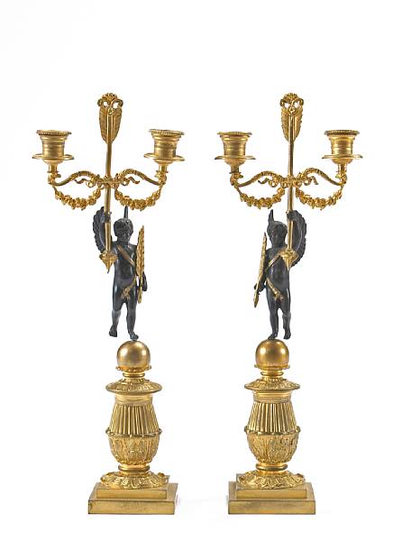 Appraisal: A pair of Empire style gilt and patinated bronze two