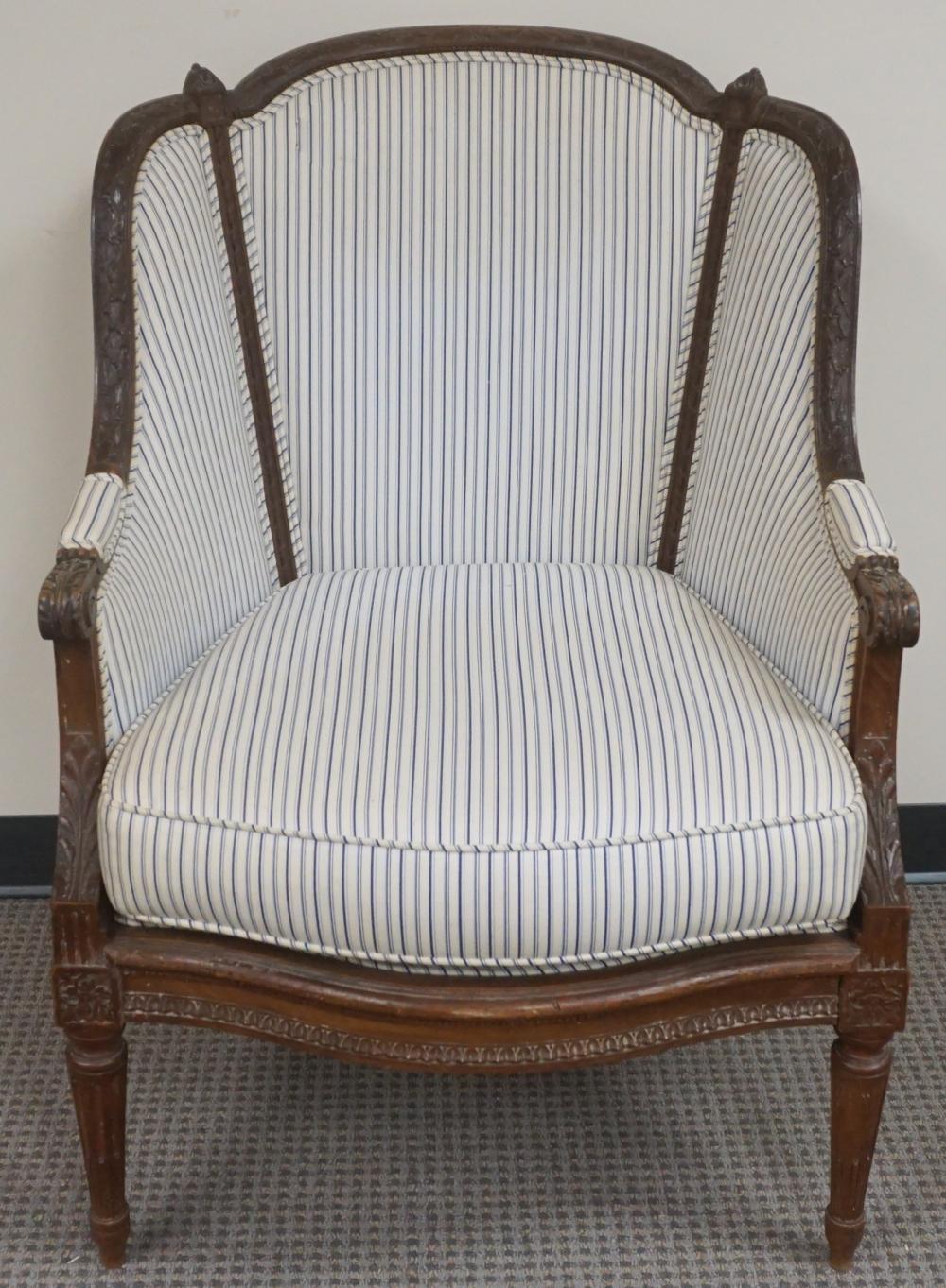 Appraisal: Louis XVI Style Carved Walnut and Stripe Upholstered Berg re