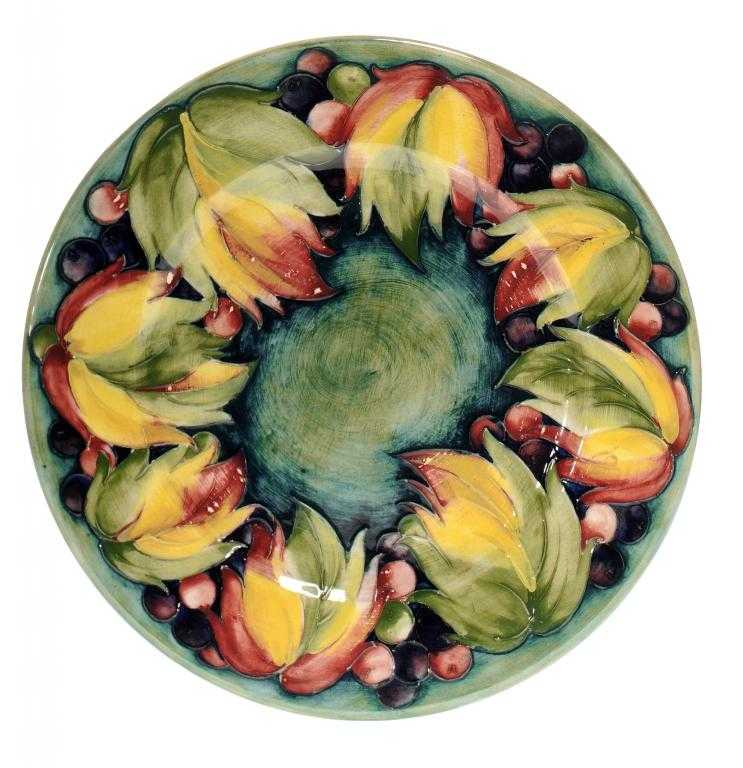 Appraisal: A MOORCROFT LEAF AND GRAPE PLATE DESIGNED BY WILLIAM MOORCROFT