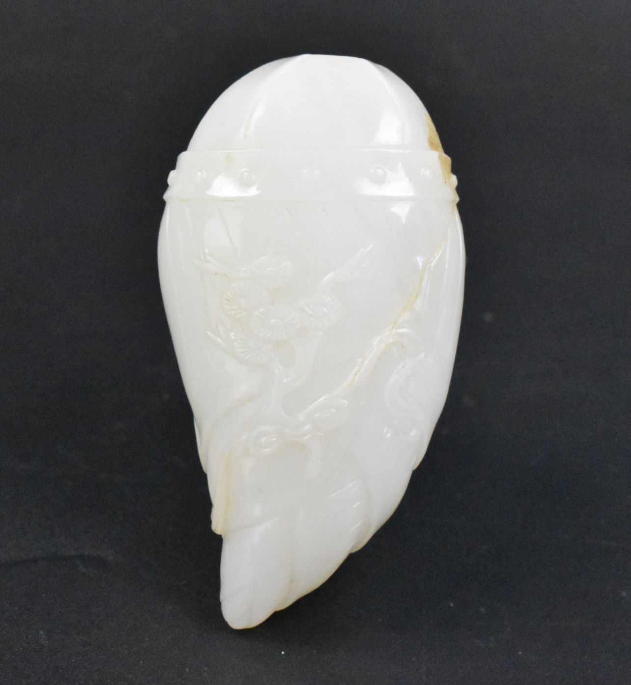 Appraisal: A Chinese white jade carved snuff bottle with incised flower