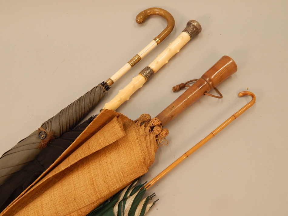 Appraisal: Various parasols to include a Victorian example with an ivory