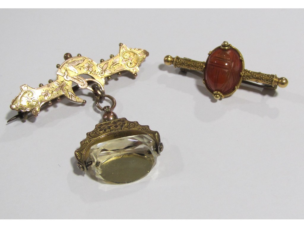 Appraisal: Lot comprising two Victorian gold bar brooches on with carved