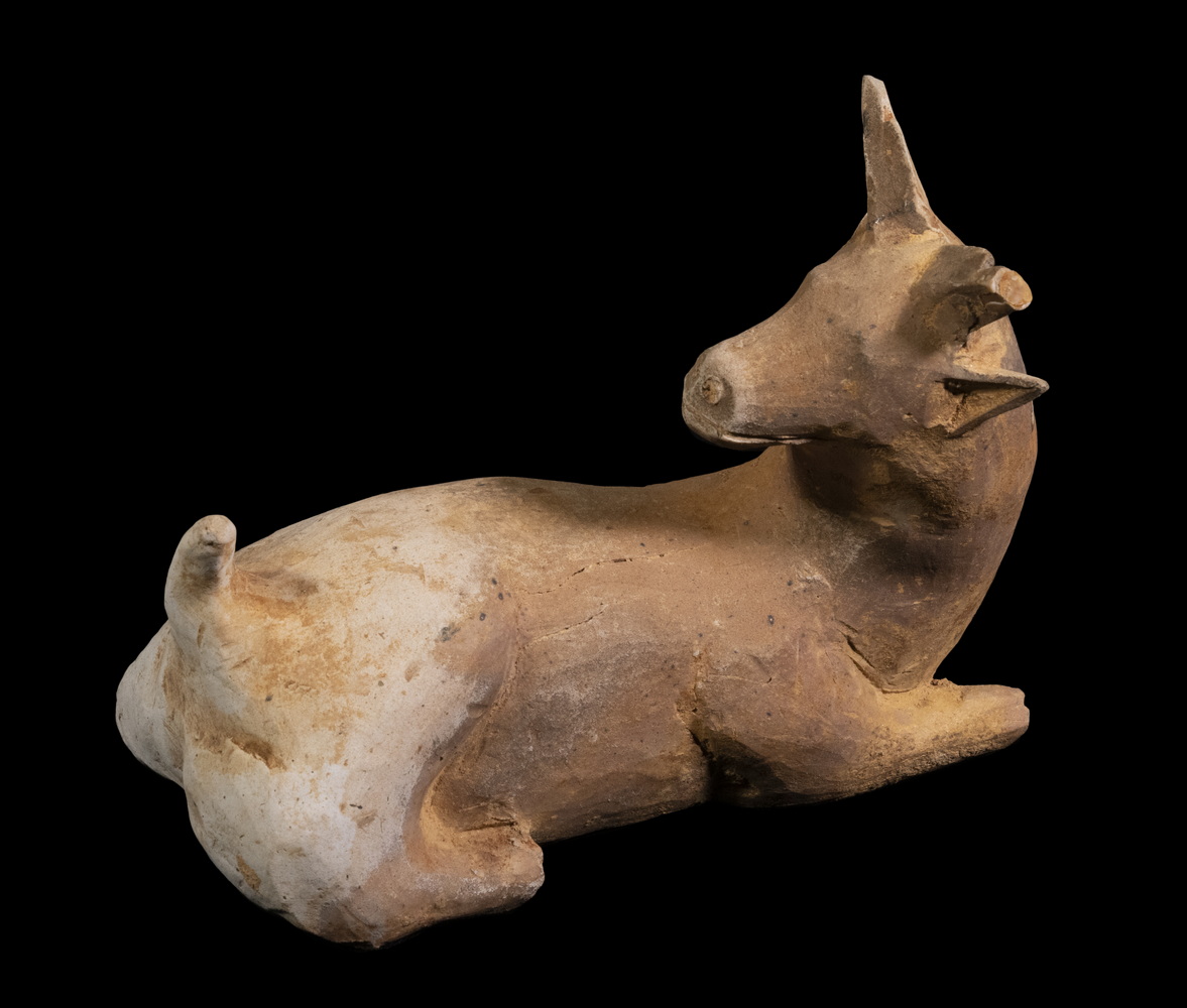 Appraisal: CHINESE HAN DYNASTY POTTERY FIGURE OF A DEER A Recumbent