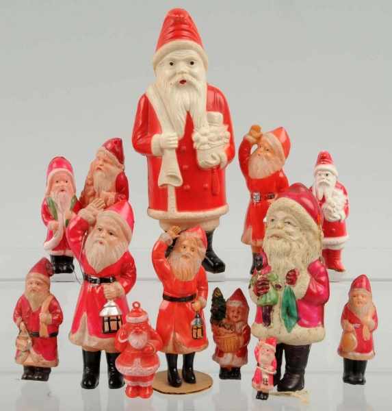 Appraisal: Lot of Celluloid Santas Condition Excellent Size Largest T