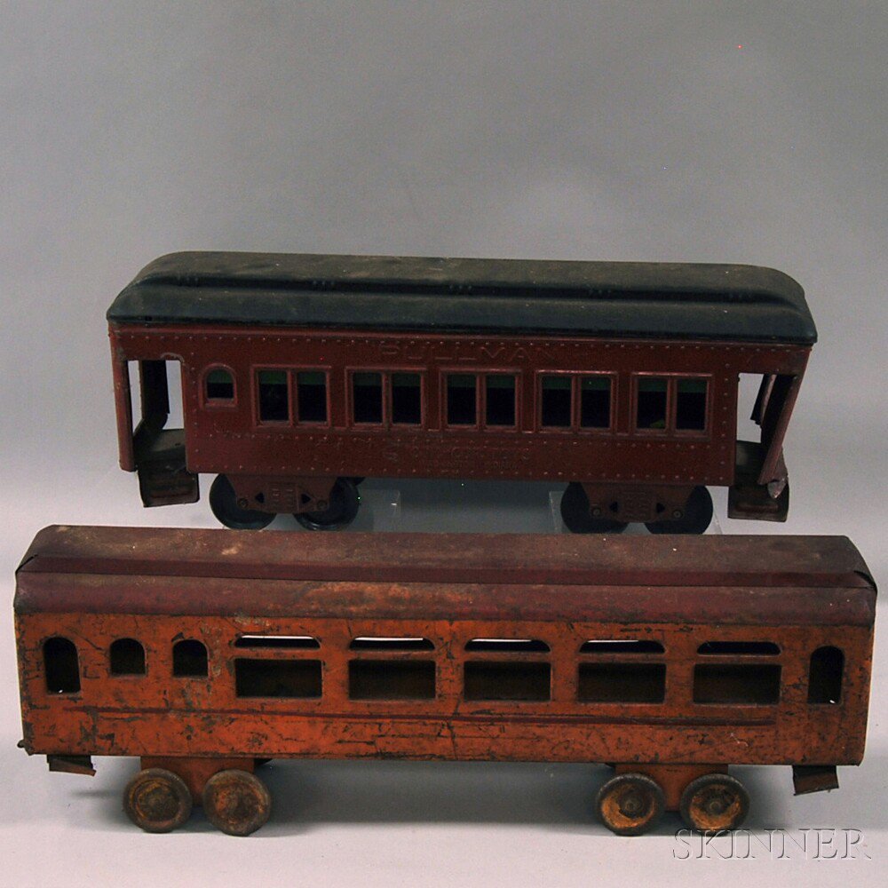 Appraisal: Two Painted Pressed Metal Passenger Train Cars including a red-painted