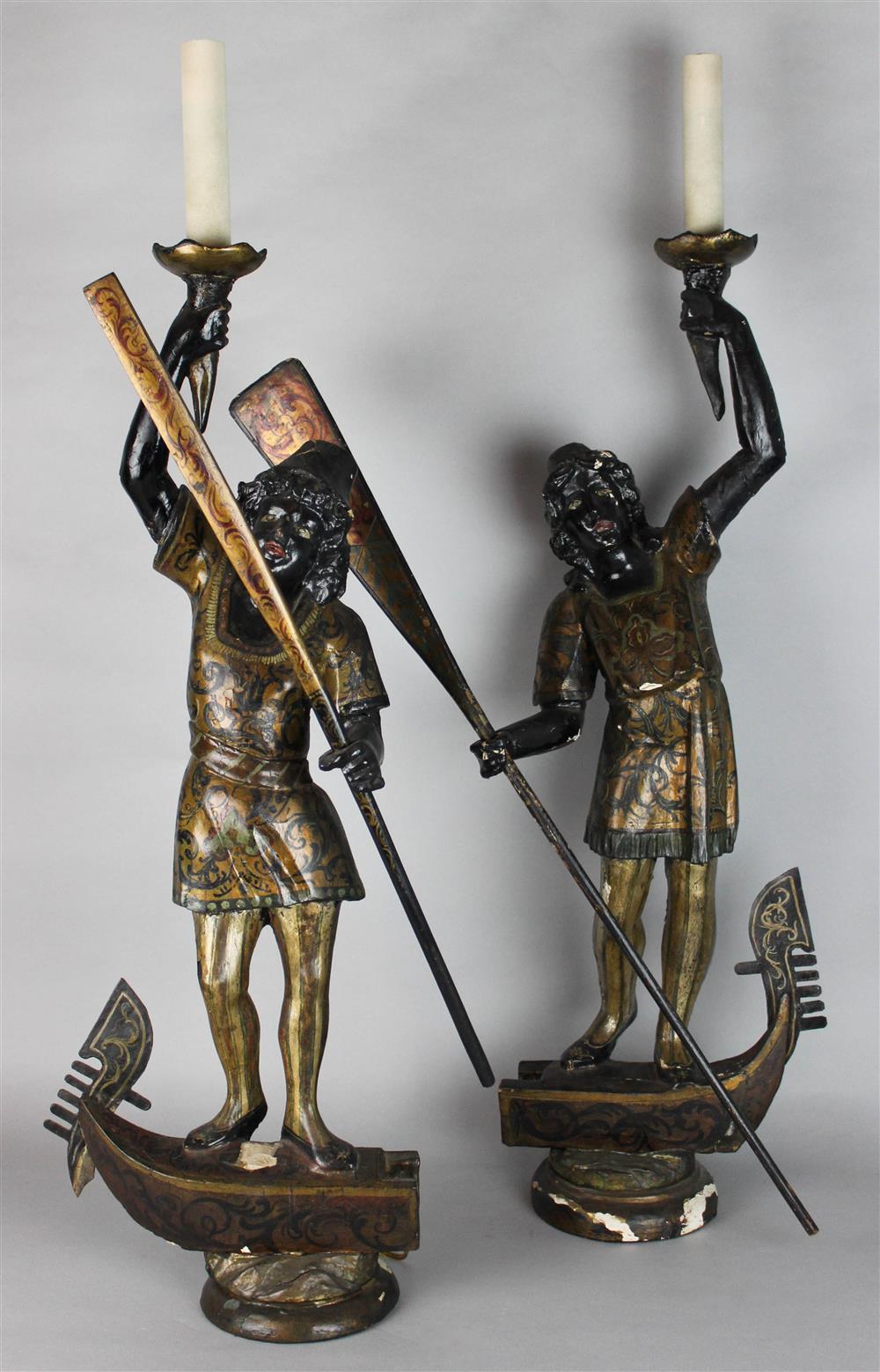 Appraisal: PAIR OF VENETIAN PARCEL-GILT AND POLYCHROME BLACKAMOORS the wood figures