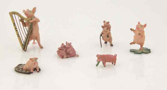 Appraisal: A collection of six metal painted miniature pigs