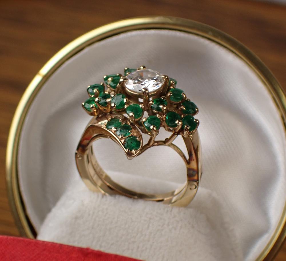 Appraisal: DIAMOND EMERALD AND FOURTEEN KARAT GOLD RING with a cluster