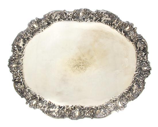 Appraisal: Silverplate Tray of oval form centered with a shield form