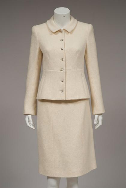 Appraisal: Cream wool Chanel skirt suit fall Seven-button tailored jacket with