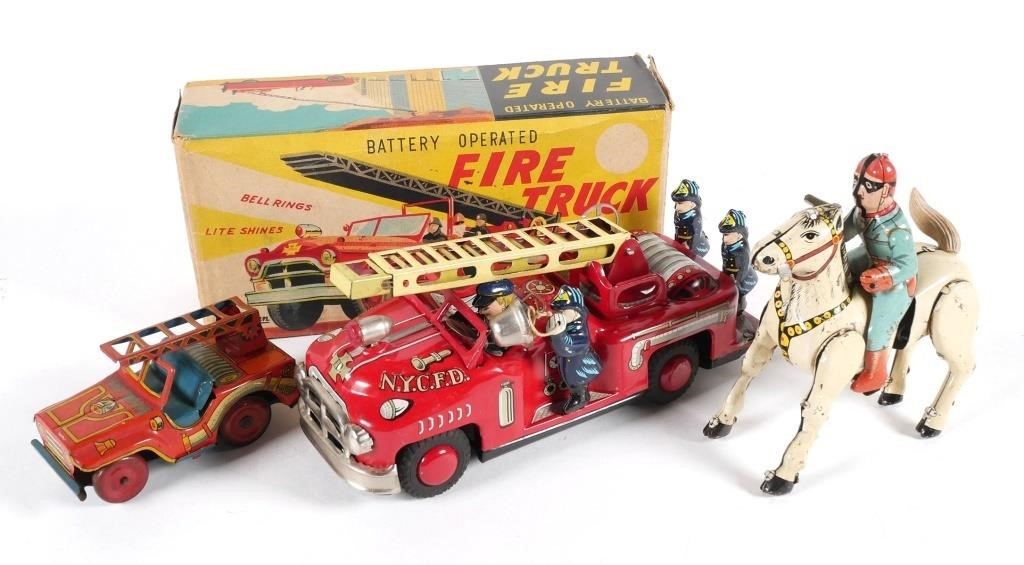 Appraisal: JAPAN TIN LITHO CRAGSTAN FIRE TRUCK W HORSE RIDERBattery Operated