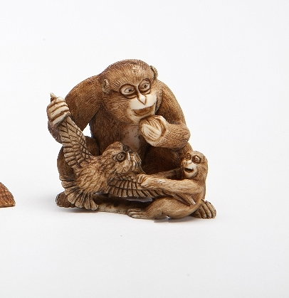 Appraisal: A JAPANESE IVORY NETSUKE of a monkey and young holding