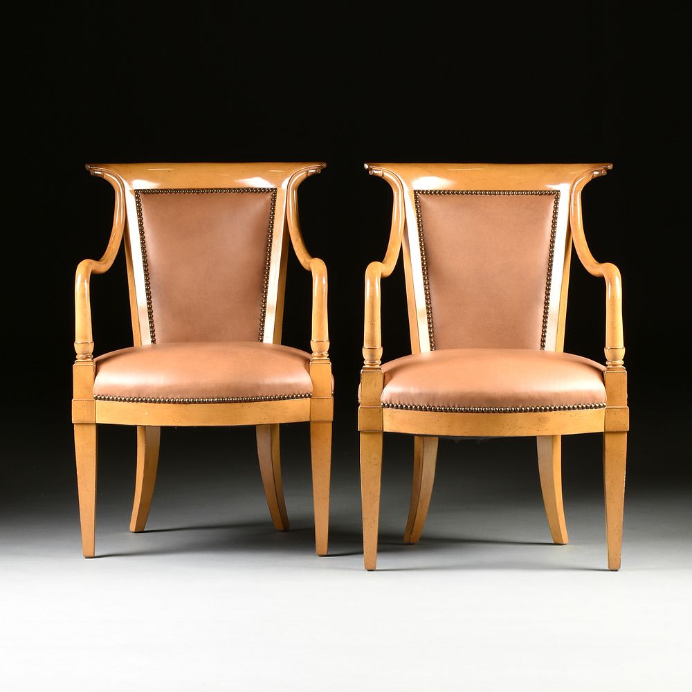 Appraisal: A PAIR OF BIEDERMEIER STYLE FAUX LEATHER UPHOLSTERED MAPLE ARMCHAIRS