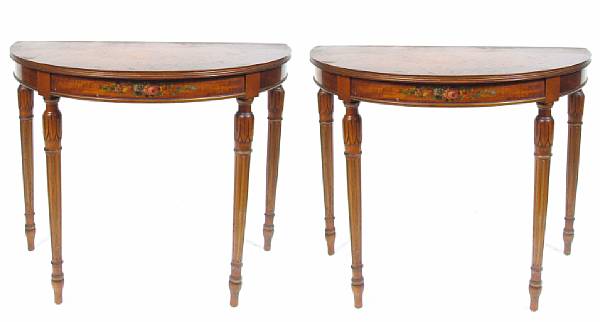 Appraisal: A pair of Edwardian paint decorated demilune console tables height