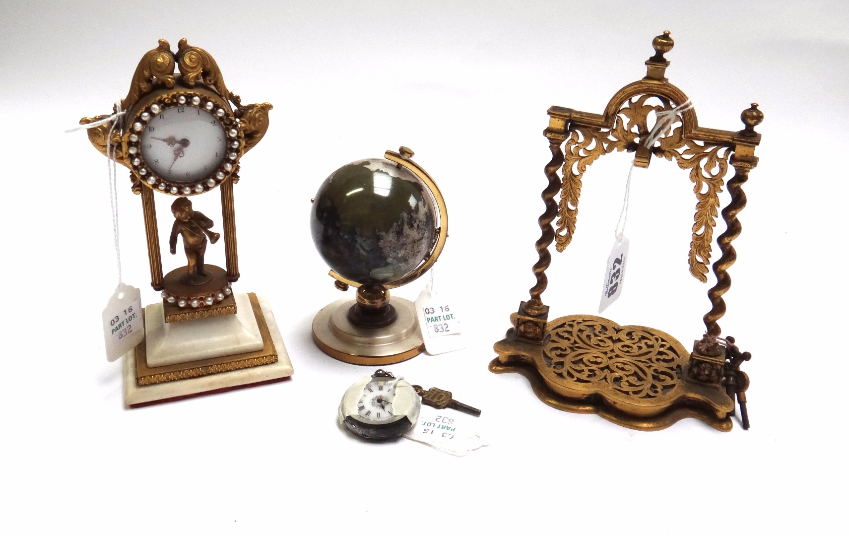 Appraisal: A Victorian brass pocket watch stand the frame raised on