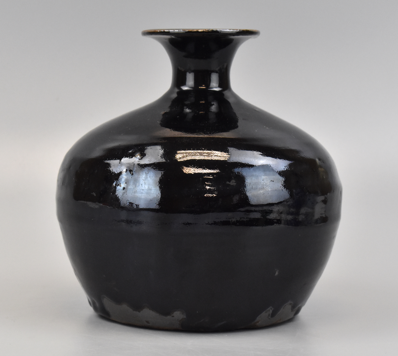 Appraisal: A Chinese black glazed Tulu vase Ming Dynasty Squat domed