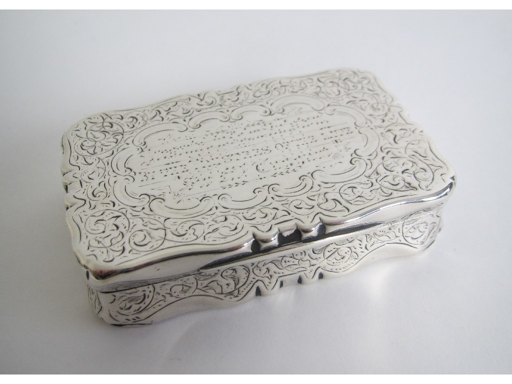 Appraisal: A Victorian presentation silver snuff box chased with scrolls and