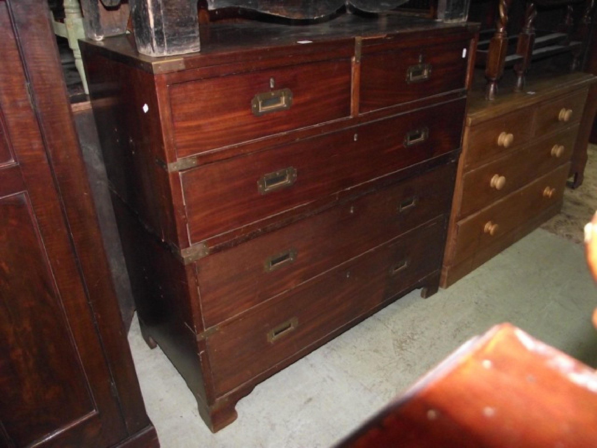 Appraisal: A th century two sectional mahogany military campaign chest fitted