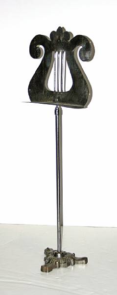 Appraisal: An adjustable polished steel lyre form music stand