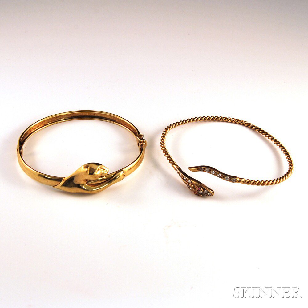 Appraisal: Two Bracelets a kt gold panther hinged bangle bracelet and