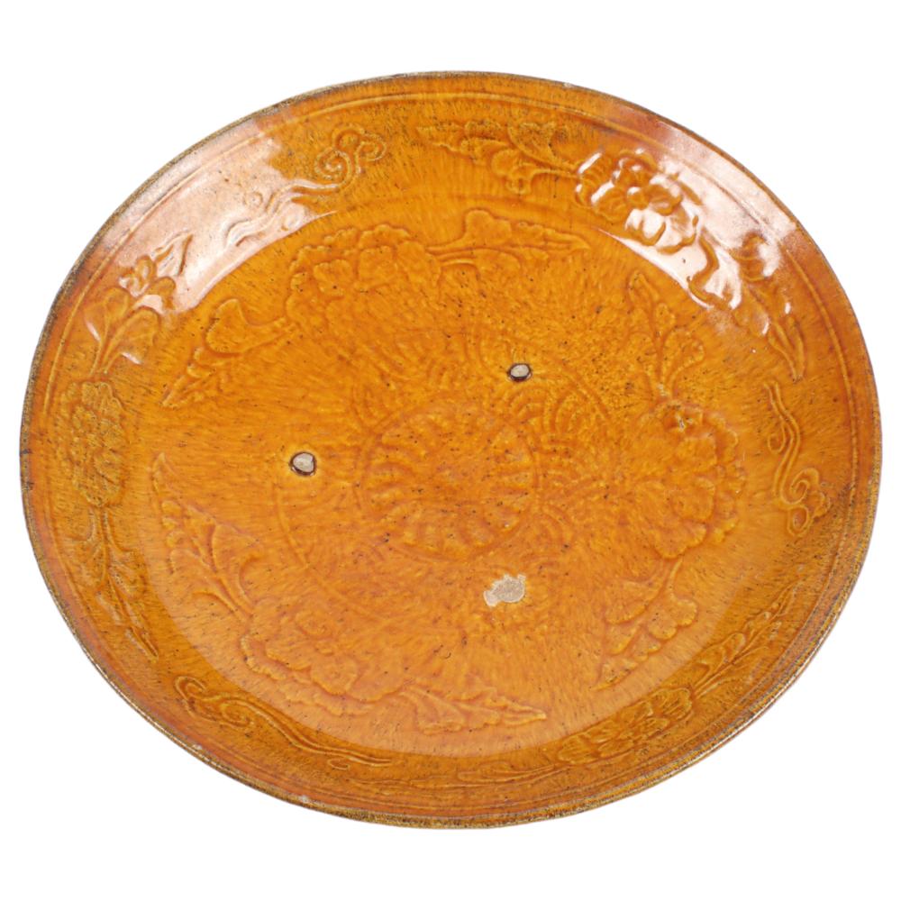 Appraisal: CHINESE AMBER GLAZE FLORAL RELIEF DECORATED PORCELAIN DISH LIAO DYNASTY