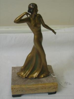 Appraisal: AN ART DECO SPELTER FIGURE modelled as a female dancer