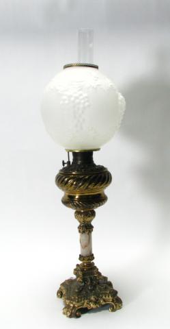 Appraisal: Victorian ornate banquet lamp base depicts cupids and gargoyles contemporary