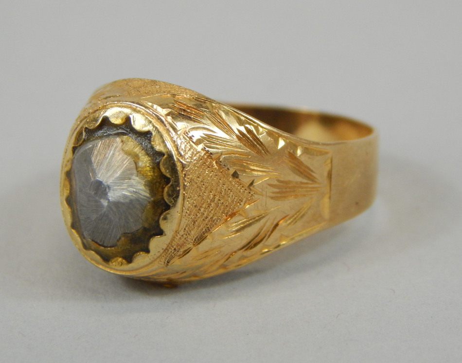 Appraisal: An ct gold gent's signet ring the central brushed stone