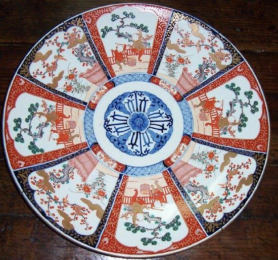 Appraisal: An Imari charger the central circular panel with stylised flowerhead