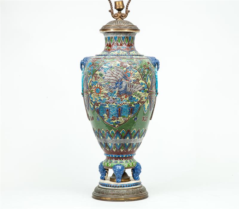 Appraisal: Relief-Decorated White Earthenware Vase Mounted as a Lamp in Estimate