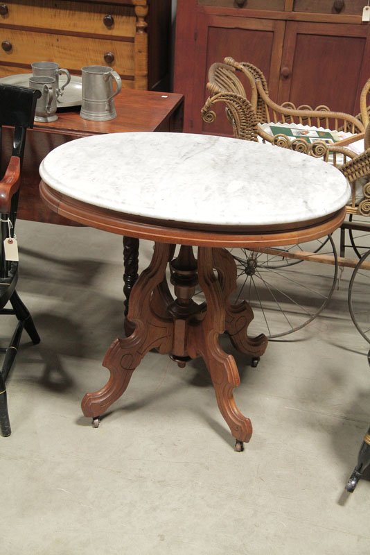 Appraisal: VICTORIAN PARLOR TABLE Oval marble top on a conforming walnut