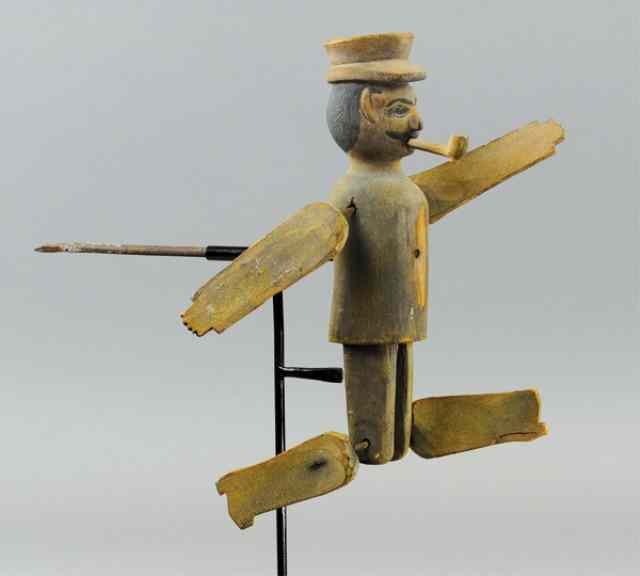 Appraisal: WHIRLIGIG OF MAN c early hand carved figural whirligig arm