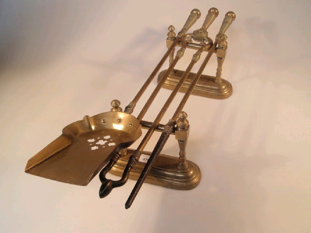 Appraisal: A set of three Victorian brass fire irons comprising shovel