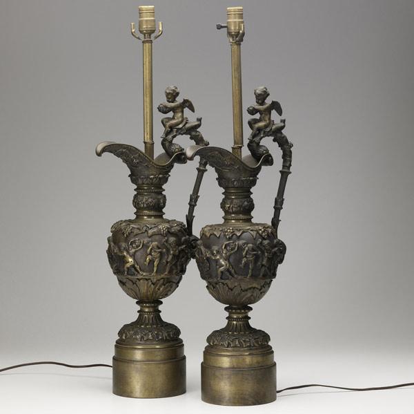 Appraisal: PAIR OF BRONZE LAMPS Ewer form the handle with putti