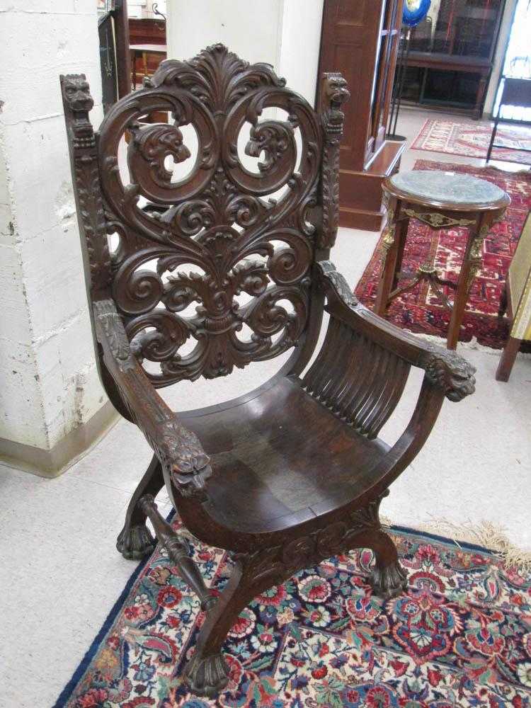 Appraisal: HIGHLY CARVED OAK ARMCHAIR American th century the deep U-shaped