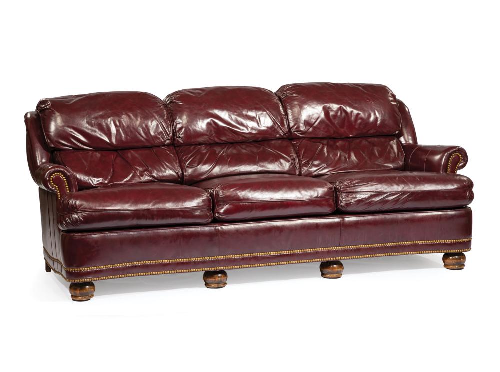 Appraisal: Cordovan Waxed Leather Sofa channeled back rolled arms three cushion