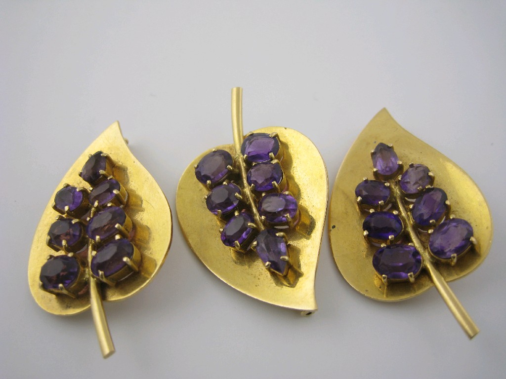 Appraisal: Three gold Leaf Brooches each claw-set seven oval-cut amethysts test