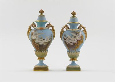 Appraisal: A matched pair of Royal Worcester vases and covers painted